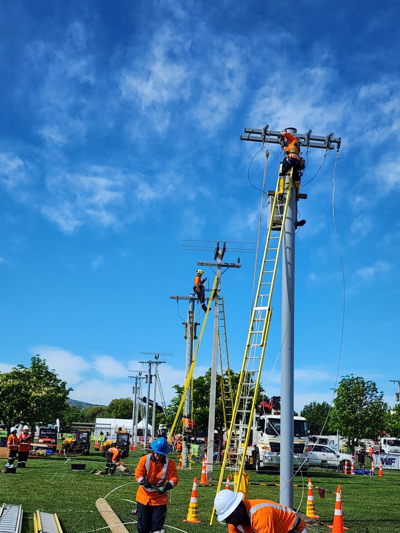Line Mechanics working on composite power poles